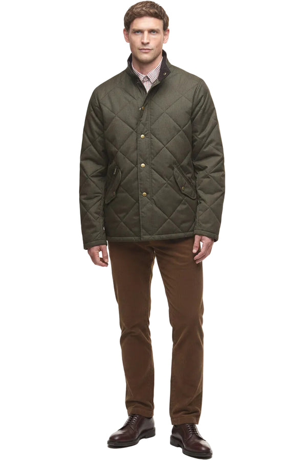 Dark olive quilted winter jacket with button front and side pockets, full outfit view