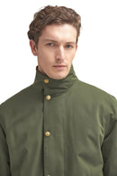 Olive waterproof jacket front view with high collar and gold snap buttons