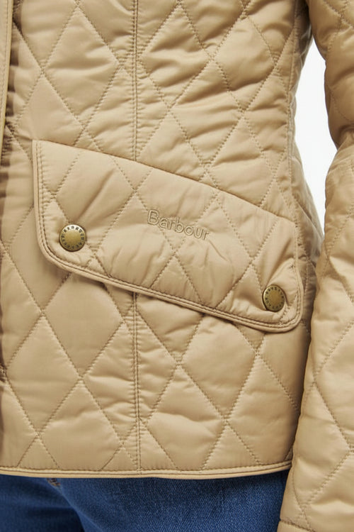 Quilted Barbour jacket with diagonal button placket, tan fabric and gold-tone snaps