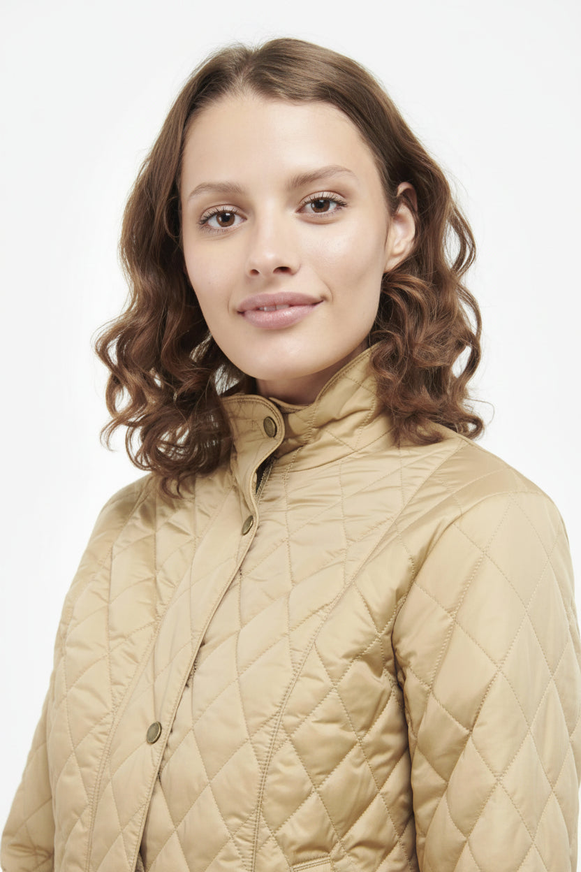 Quilted tan jacket with high stand collar and button front
