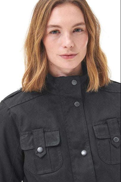 Women’s black wax jacket with stand collar and chest pockets with snap buttons