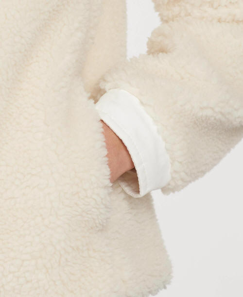 White fleece jacket sleeve cuff with soft textured lining