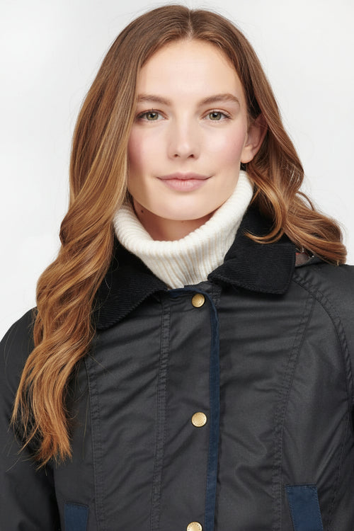 Women's navy wax cotton jacket with corduroy-style collar and gold button placket