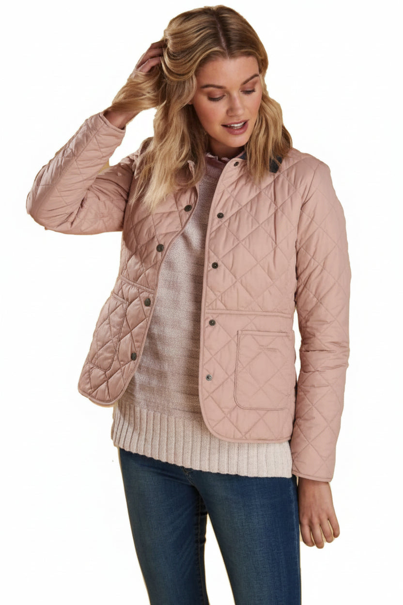 Barbour quilted pink jacket with dark stand collar, button front, flap pockets
