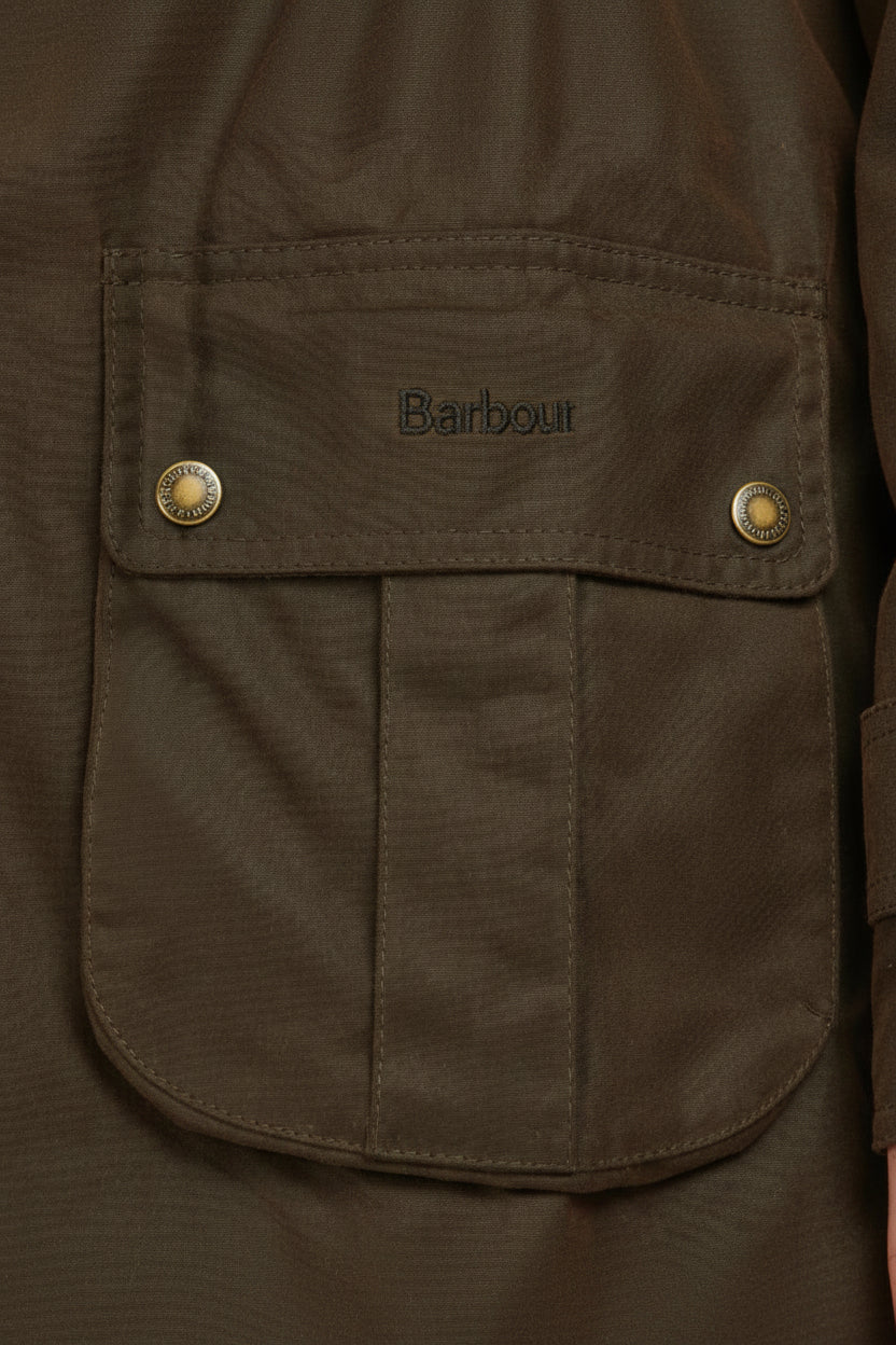 Olive wax parka jacket chest pocket with Barbour logo and snap buttons
