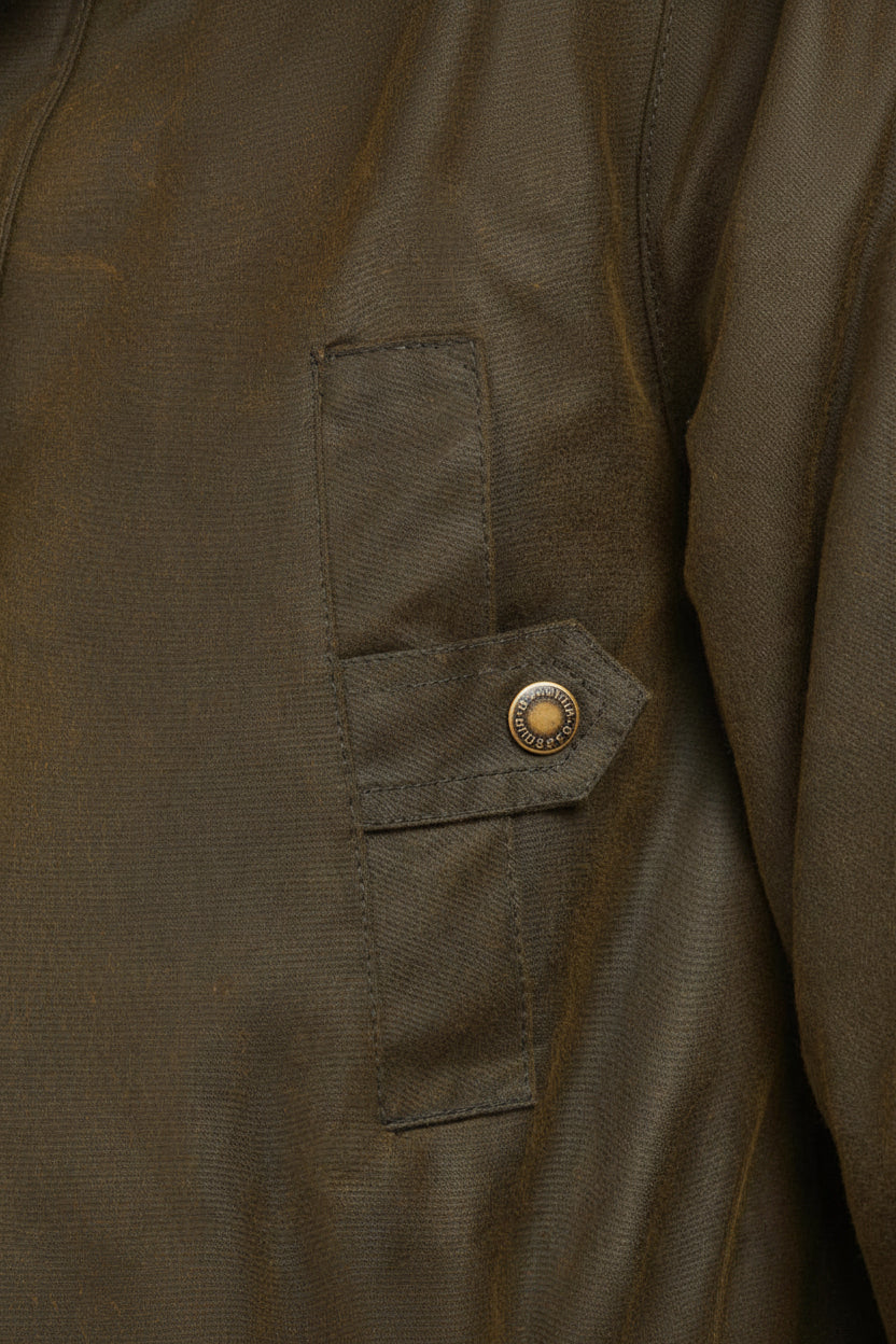 Olive wax parka jacket, fabric pocket with circular Barbour snap detail