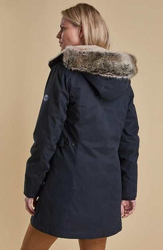 Women’s waterproof navy parka jacket with fur-trim hood, rear view