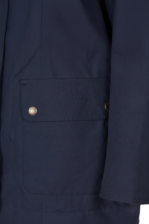 Navy jacket chest pocket with Barbour logo patch and snap button
