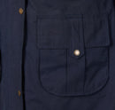 Navy waterproof jacket pocket with Barbour logo button detail