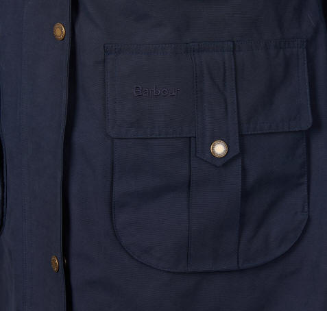 Navy waterproof jacket pocket with Barbour logo button detail