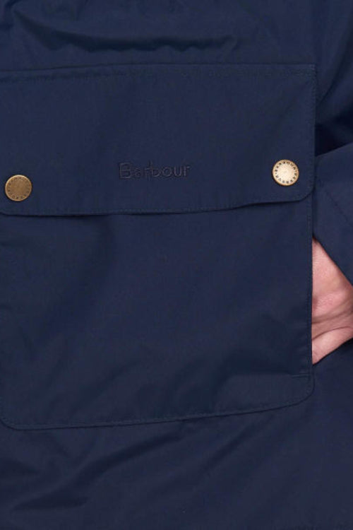 Barbour navy waterproof jacket front pocket flap, brass buttons, Barbour logo