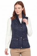 Women's navy quilted gilet with zip front, gold buttons and patch pockets; worn open