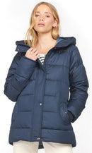 Navy quilt jacket with hood and front button placket, draped collar detail visible