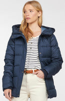 Navy quilt jacket with hood, front zip and snap buttons, and striped shirt at hem