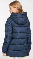 Navy quilt jacket with hood and horizontal baffle quilting from the back view