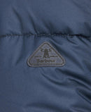 Navy quilted jacket interior panel with Barbour logo patch and stitched quilting lines