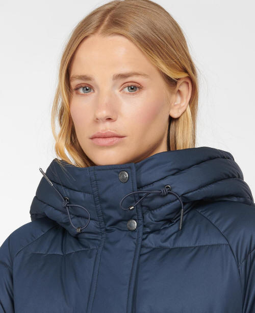Navy quilt jacket with raised hood, drawstring toggles, and snap button front