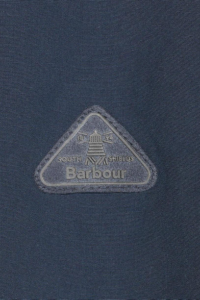 Navy waterproof jacket fabric with Barbour triangle logo patch.