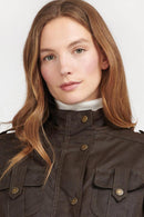 Women's Barbour wax jacket with buttoned collar and flap chest pockets