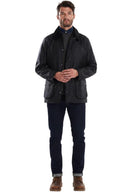 Men's black wax jacket with stand collar, snap front, and side pockets