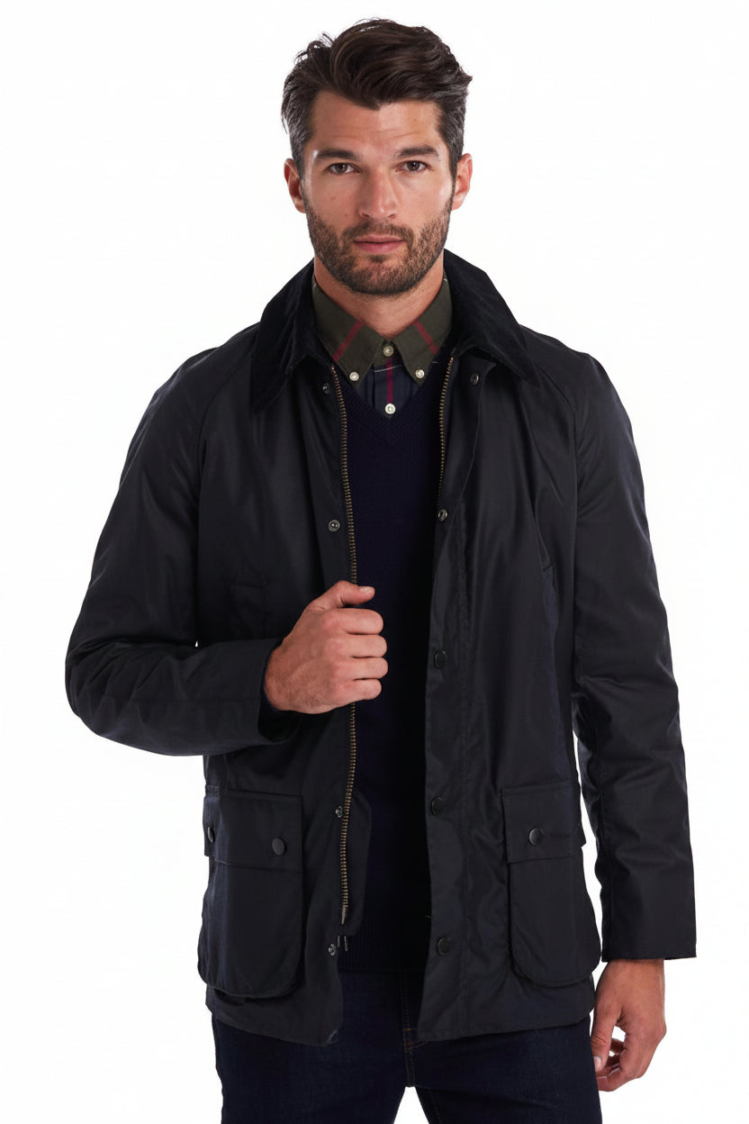 Navy wax jacket with button front, stand collar, and flap pockets