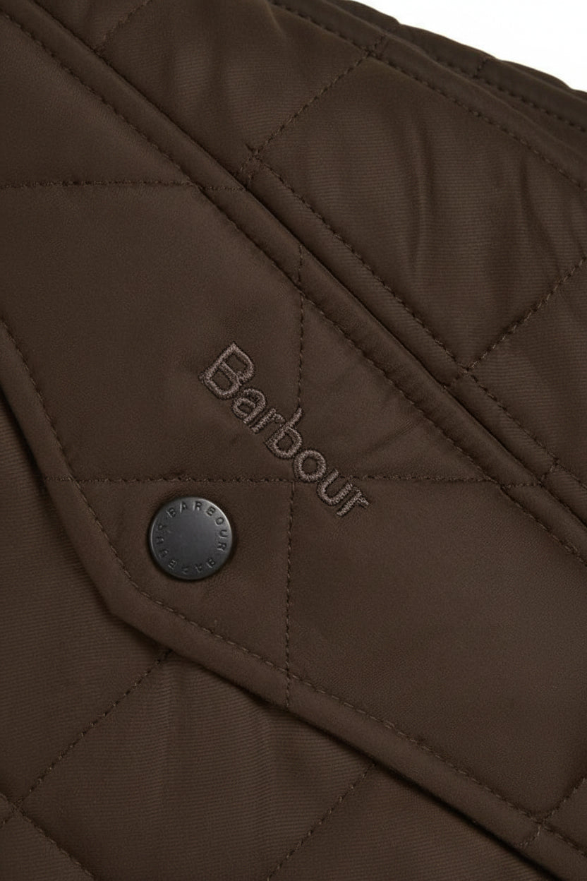 Barbour logo on dark olive quilted jacket panel with round metal button