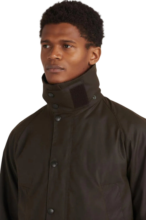 Men's dark olive waxed jacket with high collar and button-down front