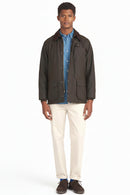 Men's dark olive waxed jacket with button-front, corduroy collar, and side pockets