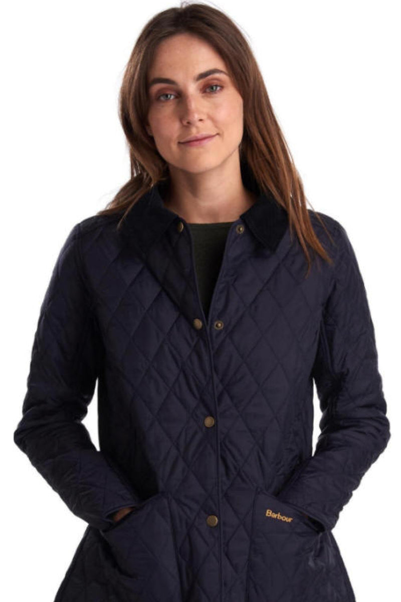 Women's navy quilted jacket with button front, stand collar, Barbour logo