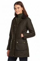 Women's dark olive wax cotton jacket, three-quarter front view with hood and chest pocket