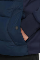 Navy quilted jacket with snap pocket and ribbed jersey side insert