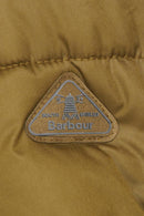 Barbour logo patch on olive green quilted jacket fabric