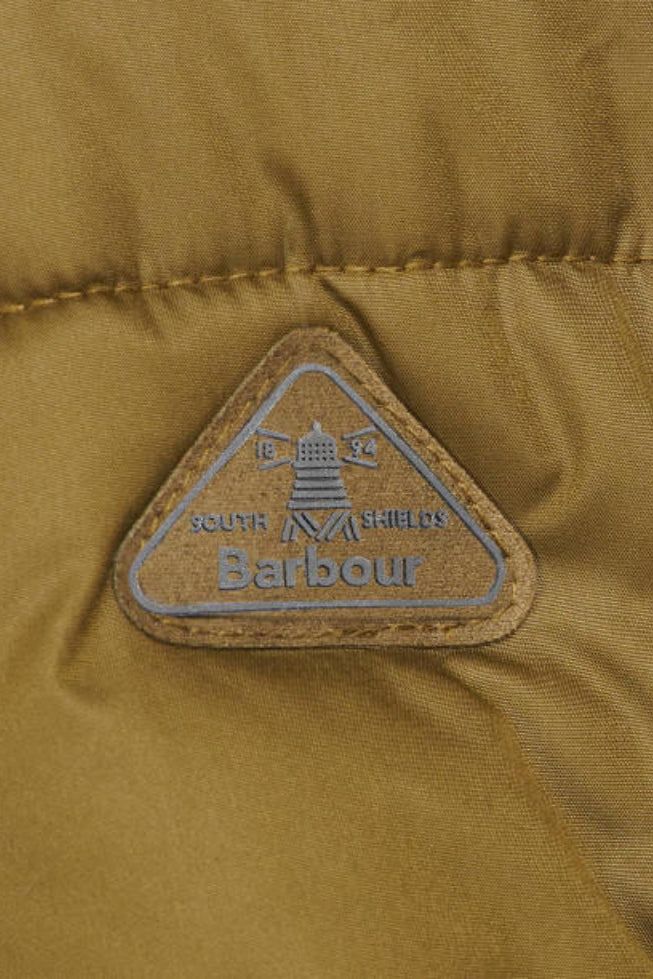 Barbour logo patch on olive green quilted jacket fabric