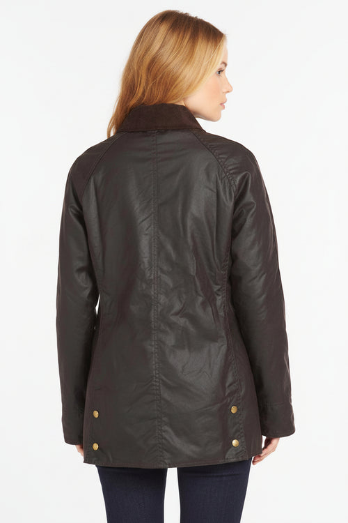 Ladies dark wax Beadnell jacket, stand collar, gold snap buttons, side patch pockets