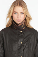 Ladies dark wax jacket front with stand collar, gold snap buttons, corduroy-style trim