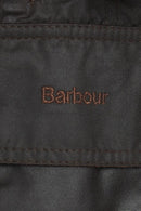 Barbour branded dark fabric jacket label patch on the interior lining