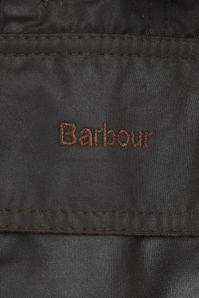 Barbour branded dark fabric jacket label patch on the interior lining