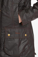 Ladies wax jacket chest pocket with gold snap button and Barbour logo patch