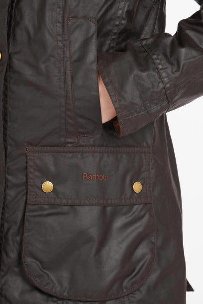 Ladies wax jacket chest pocket with gold snap button and Barbour logo patch