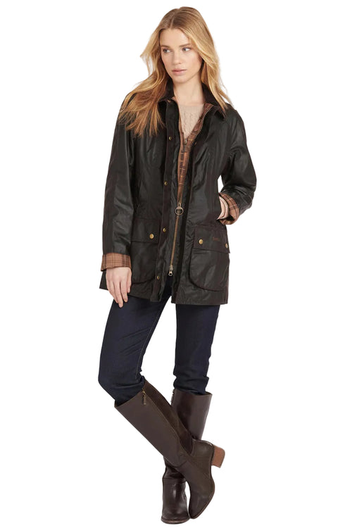 Ladies dark wax Beadnell jacket with plaid cuffs, gold snaps, and front patch pockets