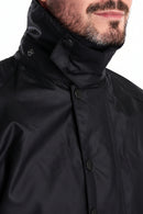 Black wax jacket with high stand collar and snap button front placket