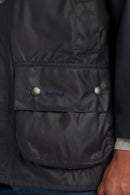 Barbour Beaufort wax jacket in dark navy, snap flap chest pocket and logo tab