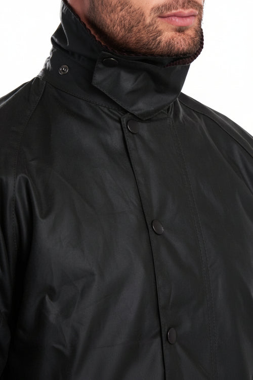 Dark wax jacket with stand collar and snap front button placket