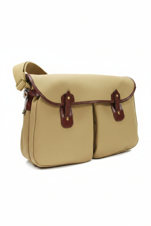 Tan canvas fishing messenger bag with brown leather flap and side pockets