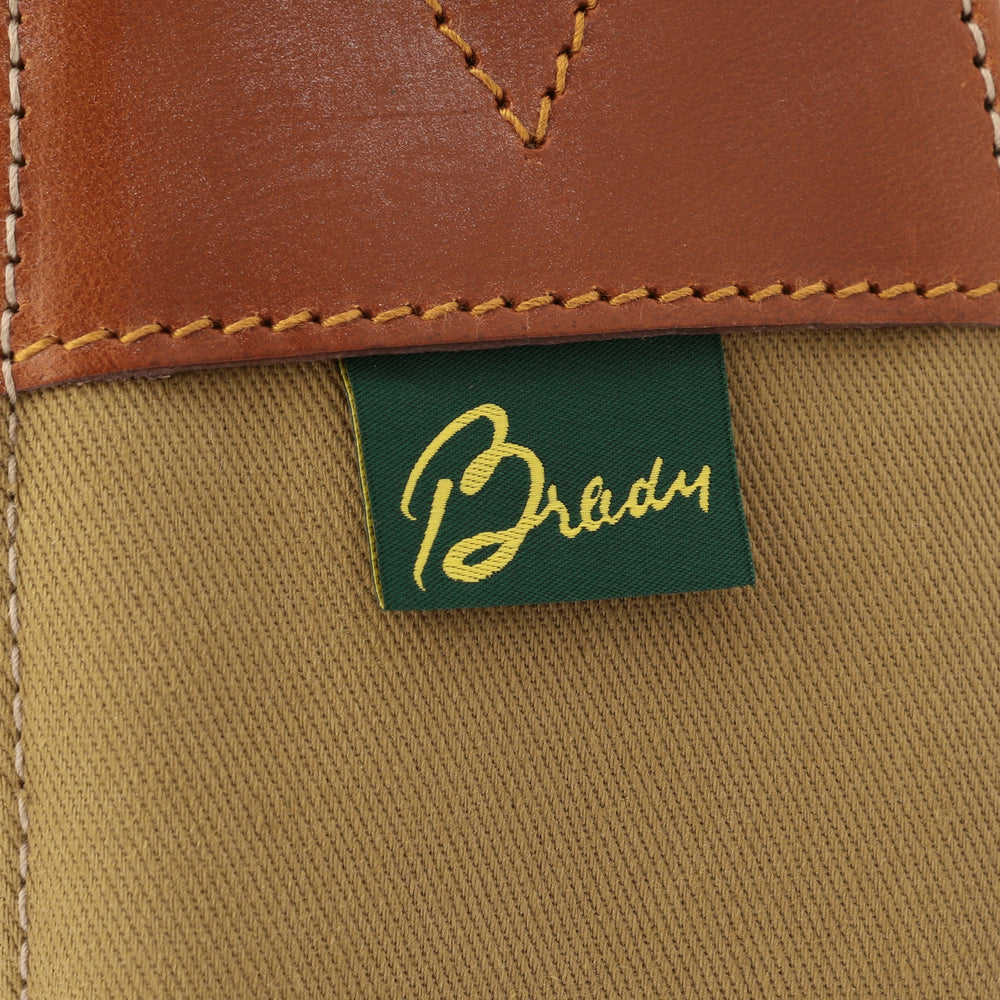 Brady logo patch on khaki lining with stitched leather trim