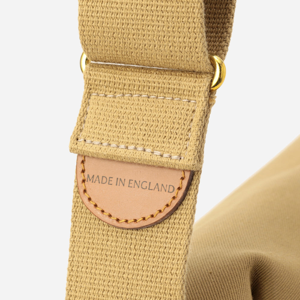 Canvas strap with leather tab and 'MADE IN ENGLAND' patch