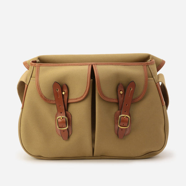 Khaki canvas messenger bag with brown leather flap pockets and top zipper lining