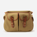 Khaki canvas crossbody bag with two front flap pockets and buckled leather straps