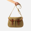 Khaki canvas crossbody bag with dual leather strap and front flap pocket details