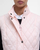 Barbour women's pink quilted gilet close-up of zip placket and snap buttons